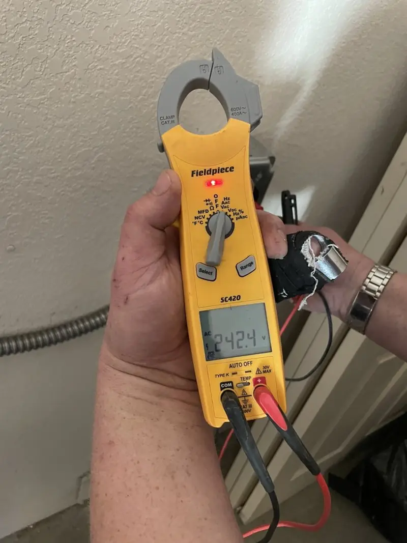 Voltage testing with clamp meter during Electrical Installation Services in Blair